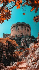 Wall Mural - Ancient Castle Under Striking Clear Sky with Vibrant Nature Surroundings