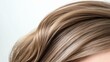 © BirD - Close-up of beautifully styled hair showcasing soft waves and a natural shine, perfect for fashion and beauty projects.