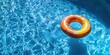 © Nikola - Inflatable Ring: Relaxing Float on Calm Swimming Pool Water Surface.