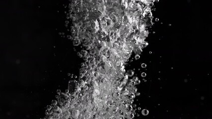 Wall Mural - super slow motion shot of air bubbles stream in water, isolated on black at 1000fps.