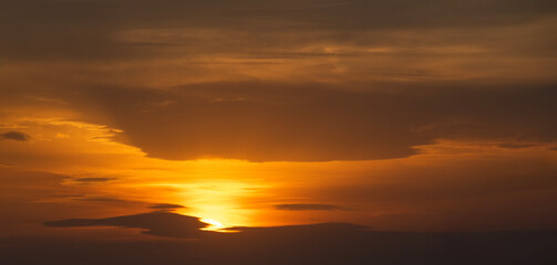 Wall Mural - beautiful bright evening sunset sky with dark clouds. sunset sky background.