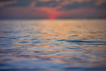 Wall Mural - inspirational sea surface with blurred seascape and horizon. sunset tropical beach with colorful sky