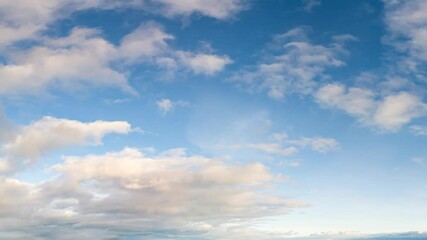 Wall Mural - Timelapse of White Clouds Drifting Across a Deep Blue Sky