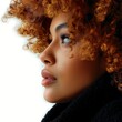 © imagemir - Close-up profile of a young Black woman with curly, auburn hair and radiant skin, exuding confidence and grace.