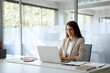 © Stock 4 You - Young professional it specialist latin hispanic business lady working on laptop pc sitting at desk in modern office space. 30s middle eastern indian woman using computer technology app for work online