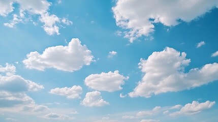 Wall Mural - beautiful blue sky scattered with fluffy white clouds creating a serene and uplifting atmosphere dur