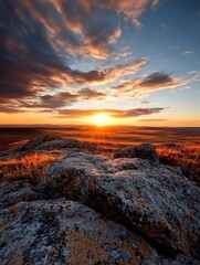 Aufkleber - Breathtaking sunset over a vast landscape with rocky formations and vibrant colors in the sky : Generative AI