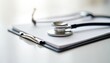 © miss irine - Close-up stethoscope on clipboard at doctors office. Medical instrument for checkup, examination, health diagnostic. Consultation, appointment with general practitioner. Healthcare, medicine, medical