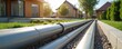 © miss irine - District heating system pipes distributing hot water in modern residential area. Infrastructure provides heat supply to houses, apartments. Geothermal, renewable energy, eco-friendly. Urban