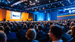 © Sergio IQstock - Large group of people attending a business conference in a bright modern hall, speaker presenting at the front, professional audience focused on screen presentation business confer