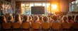 © AnggunArtworks - Children attentively watching a screen in a classroom bathed in golden sunset light