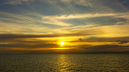 Wall Mural - stunning sunset over calm ocean waters