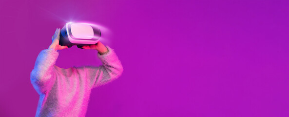 Poster - A user engages in an immersive experience with a modern virtual reality headset, fully absorbed in virtual environments. The vibrant background adds to the futuristic vibe, enhancing the activity.