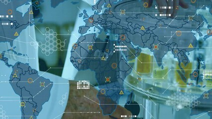 Canvas Print - processing data animation over world map in laboratory setting with scientists