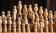 © PlatypusMi86 - Diverse wooden figures assembling in tower formation for teamwork concept