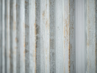 Fototapete - Close up of corrugated metal wall with rust and texture, showcasing industrial design