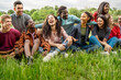 © Lomb - Diverse young friends laughing together in park enjoying outdoor moment