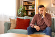 © Graphicroyalty - Closeup of man suffering from headache at home, touching his temples, copy space, blurred background. Migraine, headache, stress, tension problem, hangover concept