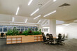© Westend61 - Modern office interior with green plants and open plan design