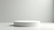 © MuhammadFaisol - Minimalistic white podium, presentation stage, elegant backdrop for product display