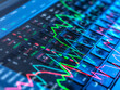 © Westend61 - Colorful stock market graphs displayed on a computer keyboard representing financial data and analysis