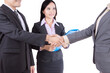 © Creativa Images - Business people shaking hands on studio