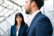 © Westend61 - Female entrepreneur standing by male colleague during discussion in office meeting