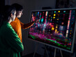© Westend61 - Two people analyzing data on an augmented reality screen in a modern workspace