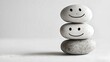 © Karen - Stacked smiling stones showing emotional balance
