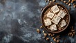 © Sumon - Artisan Handmade Soap Cubes in Bowl Brown Granules Dark Background
