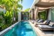 © Zeeshan - Luxurious bungalow pool with canopy sun loungers and a secluded tropical garden.