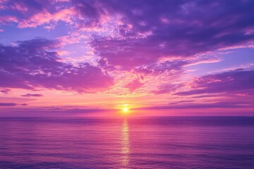 Aufkleber - Vibrant sunset over calm ocean waters reflecting shades of purple and orange in the evening sky