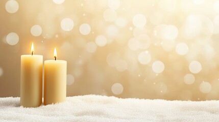 Wall Mural - Two candles are lit on a snowy surface. The candles are lit and the snow is white