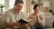 © Svitlana Vorotniak - Couple with Down syndrome reading the Bible and praying. Religious faith and inspiration, Christian prayer and Bible study for people with disabilities.