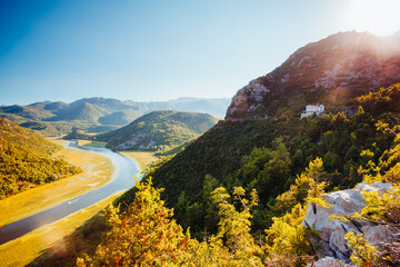 Fototapete - A fantastic view from above of the Rijeka Crnojevica valley on a sunny day. Skadar Lake National Park, Montenegro, Europe.