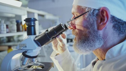 Wall Mural - focused scientist wearing white lab coat and glasses meticulously adjusting precision scientific equ