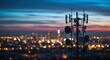 © GS-Studio - Telecommunication Mast at Dusk: A towering telecommunication mast, silhouetted against a vibrant twilight sky, dominates the skyline.