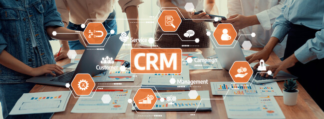 Aufkleber - A professional team collaborates using technology in an office environment, focusing on customer relationship management strategies. Tools and data drive effective decision-making. Amity