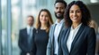 © nirabs_creative - a group of diverse businesspeople standing together, looking confident and professional. The group appears to be smiling, with a focus on leadership and collaboration