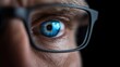 © danadesa - Close-up of a person's eye and eyeglasses