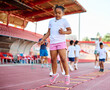 © Lumos sp - child sport athlete childhood girl competition fun young outdoor active exercise kid running fitness training athletic game healthy group play team school exercising jump