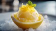 © fivan - Vivid lemon sorbet-style gelato with a citrus zest topping, served in a frozen lemon rind for a natural presentation