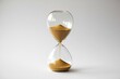 © KANTIC - Sands of Time Flowing in Clear Glass on White Background, Conceptual Time Management, Soft Light, Simple Composition, Gold Sand