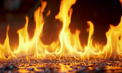 Wall Mural - Captivating Flames Dancing on a Reflective Surface Filling the Scene with Light and Intense Warmth in an Uncontrolled Show of Energy