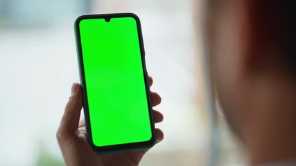 Hands scrolling chromakey mobile phone in office closeup. Unknown businessman