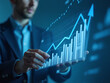 © Aitfatoul - Businessman illustrates growth graph and analyzes financial data , affaires, finance,