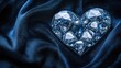 © Sampao - A collection of loose diamonds arranged in a heart shape on a deep velvet fabric.