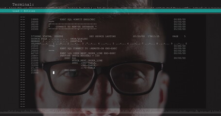 Image of data processing on computer screen over man wearing glasses