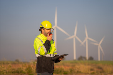 Aufkleber - Engineer man working with tablet at windmill farm Generating electricity clean energy. Wind turbine farm generator by alternative green energy.