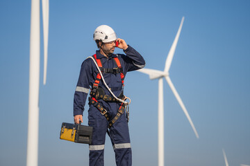 Aufkleber - Engineer man working at windmill farm Generating electricity clean energy. Wind turbine farm generator by alternative green energy.